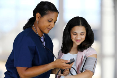 healthcare staff assisting the patient