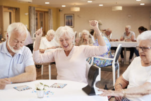 Senior Woman Winning Game Of Bingo