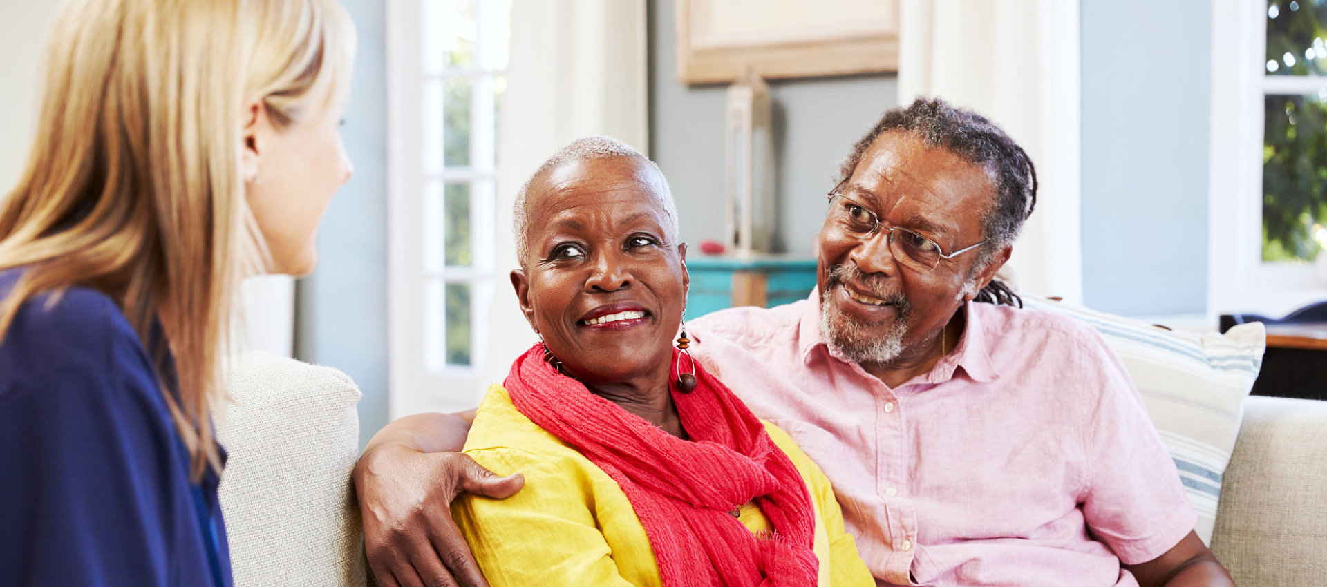 old couple talking with a healthcare staff