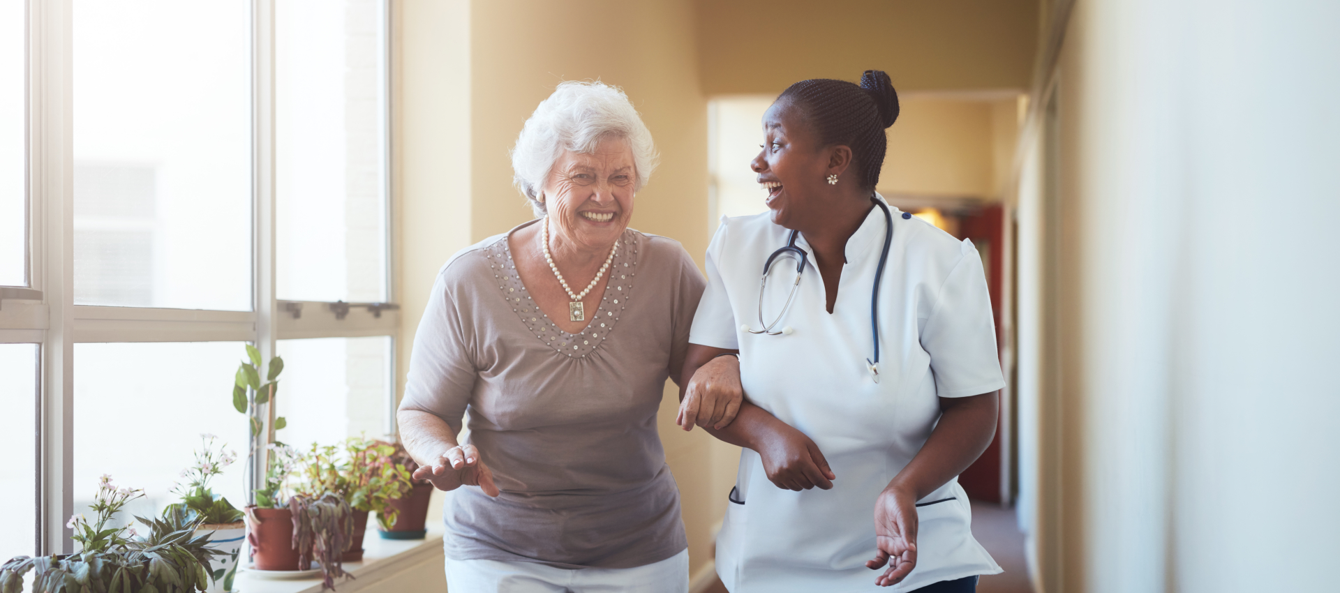 senior woman and woman smiling