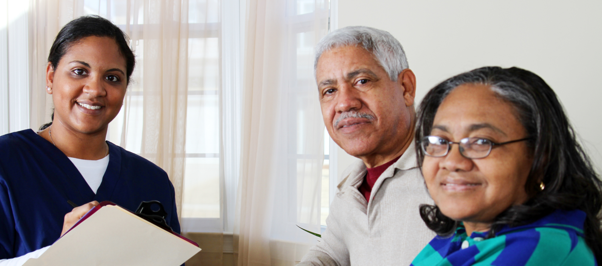 old couple talking with a healthcare staff