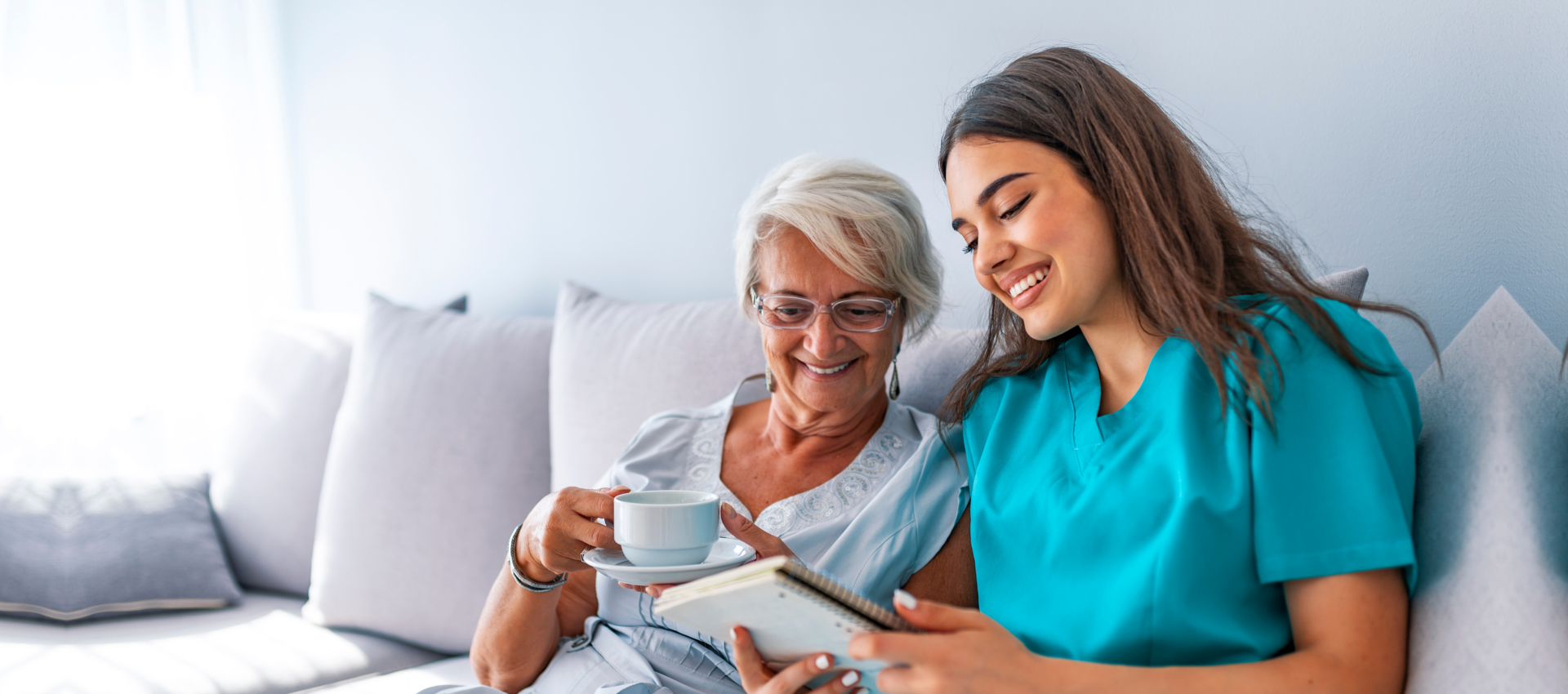 senior woman and woman reading