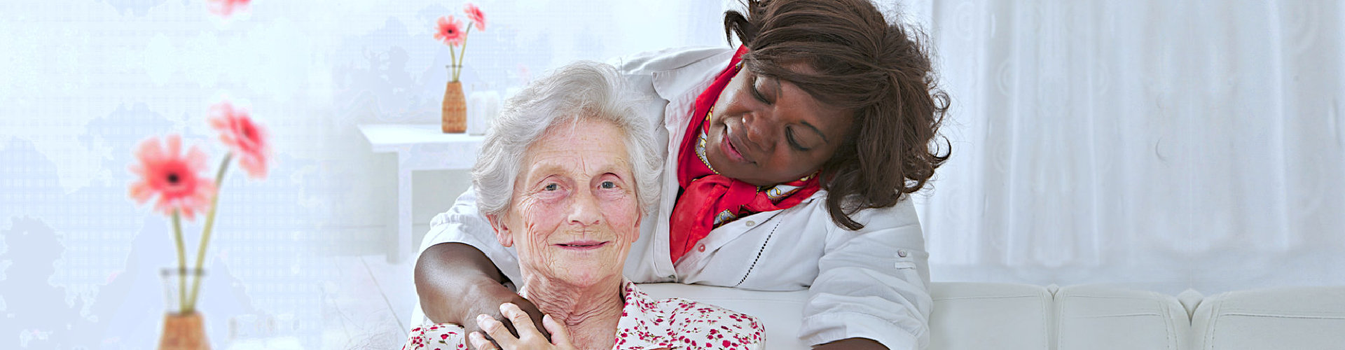old lady smiling with her caregiver